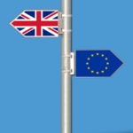 A sign post with a union jack flag pointing one way and the EU pointing the other