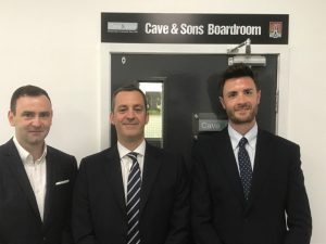 Business men standing by boardroom entrance