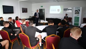 A picture of the Cave & Sons team presenting to the Northampton Town FC First Team